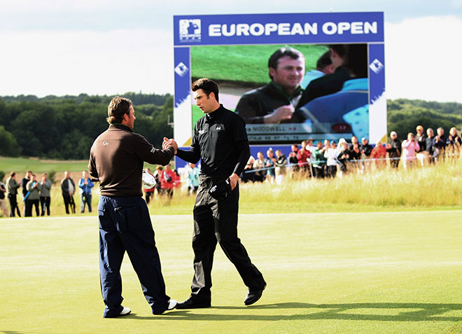 ASH, UNITED KINGDOM - JULY 06:  Ross Fisher of England shakes hands with Graeme McDowell of Northern Ireland on the 18th green during the final round of The European Open on July 6, 2008 at the London Golf Club in Ash, Kent, England.  (Photo by Andrew Redington/Getty Images)